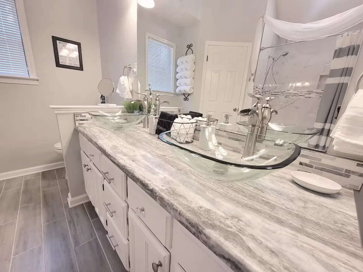 Bathroom vanity with glass vessel sinks